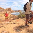 Hikers along a scenic desert trail near Cabo San Lucas in Baja California Sur, Mexico - stock photo